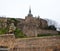 The steeple on the top of Saint Michael\'s Mount with golden statue of Saint Michel. Normandy, France.