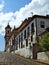 The steeply sloping flagstone street to the church on top of the