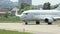 Steering passenger airliner at civil airport, turning airplane