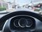 Steering Wheel Against Blurred Speedometer and Road Background