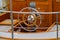 Steering wheel on the deck of a boat