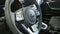 Steering wheel of new Kia. Modern auto interior details. Car dealership. Vehicle local distribution. Official automobile dealer. I