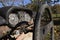 Steering wheel and rusty speedometer on vintage car dashboard