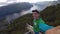 Stegastein viewpoint, Norway - July 22, 2018: Young traveller taking selfie on the top of view point with Beautiful