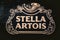 Stella Artois emblem carved on wood, beer