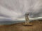 A stellar at the Slope Point on the most Southern point of the South Island of New Zealand with moody sky