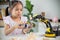 STEM education concept. Asian students learn at home by coding robot arms in STEM, mathematics engineering science technology