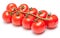 Stem of fresh ripe cherry tomatoes on white