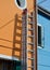 Step ladder painting houses on the Burano