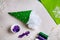 Step-by-step instructions: decorative green felt Christmas tree with purple sequins and white beads. Crafts with