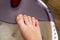 Step-by-step pedicure at home. Pedicure at home, soaking your feet in a special foot massage bath. Photo of a senior women`s feet