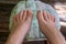Step-by-step pedicure at home. Pedicure at home, soaking your feet in a special foot massage bath. Photo of a senior women\'s feet