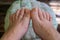 Step-by-step pedicure at home. Pedicure at home, soaking your feet in a special foot massage bath. Photo of a senior women\'s feet