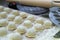 Step-by-step process of making homemade dumplings, ravioli or dumplings