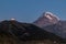 Stepantsminda - Distant view on Gergeti Trinity Church in Stepansminda, Georgia. Caucasus