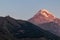 Stepantsminda - Distant view on Gergeti Trinity Church in Stepansminda, Georgia. Caucasus