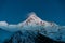 Stepantsminda, Gergeti, Georgia. Night View Peak Of Mount Kazbek Covered With Snow. Beautiful Georgian Nature Landscape