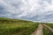 Steppe road in cloudy weather. Siberia