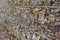 Stepped wire mesh gabion wall with granite boulders blurred in perspective