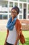 Stepping outside for a break time boost. Portrait of a happy young woman standing outside on campus grounds.