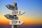 Steps 1, 2, 3, 4 - wooden signpost, sunset sky