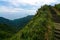 Steps along a steep ridge on the Caoling Historic Trail in Taiwan, with Turtle Island in the background