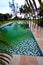 Steps into green swimming pool