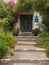 Steps leading to set of doors with assorted plants