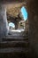 The steps leading up to the cut in the rock passage. Light falls from windows, illuminates the cave