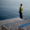 Steps and Lone Male looking out to Sea