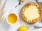 Steps for making a simple lemon tart with crackers and creme filling.