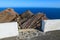 Steps to viewpoint on Punta Entellada near Las Playitas where tourists can see mountain cliff and ocean, Fuerteventura, Canary