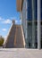 Steps up, crossed by shadows, on a sunny day at the Stavros Niarchos Cultural Center in Athens, Greece