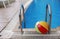 Steps in a water pool and a children\'s ball