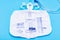 Sterile Urinary Drainage Bag with Anti-Reflux Tower isolated on blue background