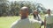 Stern african american male soldier instructing diverse group at obstacle course, turning to camera