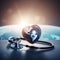 A stethoscope on a blurred background with a heart symbol with world map