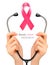 Stethoscope with a breast cancer awareness ribbon.