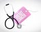 Stethoscope and breast cancer tag