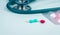 Stethoscope, capsule, and tablets pills on doctor table or nurse desk. Health checkup. Medical healthcare and medicine background