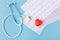 Stethoscope, cardiogram and red heart