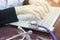 Stethoscope on the desk and blurred doctor womanâ€™s hand typing keyboard of notebook for working at the hospital