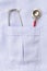 Stethoscope In doctors lab coat pocket