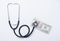 Stethoscope with dollar on white background, health insurance concept