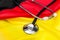 Stethoscope on German flag. Medical concept