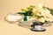 Stethoscope, gift box and eustoma flowers on beige background, closeup. Happy Doctor\\\'s Day