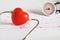 Stethoscope with  heart ball on paper heart sign wave