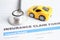 Stethoscope on Insurance claim accident car form, Car loan, insurance and leasing time concepts