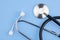 A stethoscope is isolated on a blue background. The concept of medical equipment, cardiology, lung diagnosis, coronavirus,