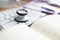 Stethoscope keyboard and diary on the table.